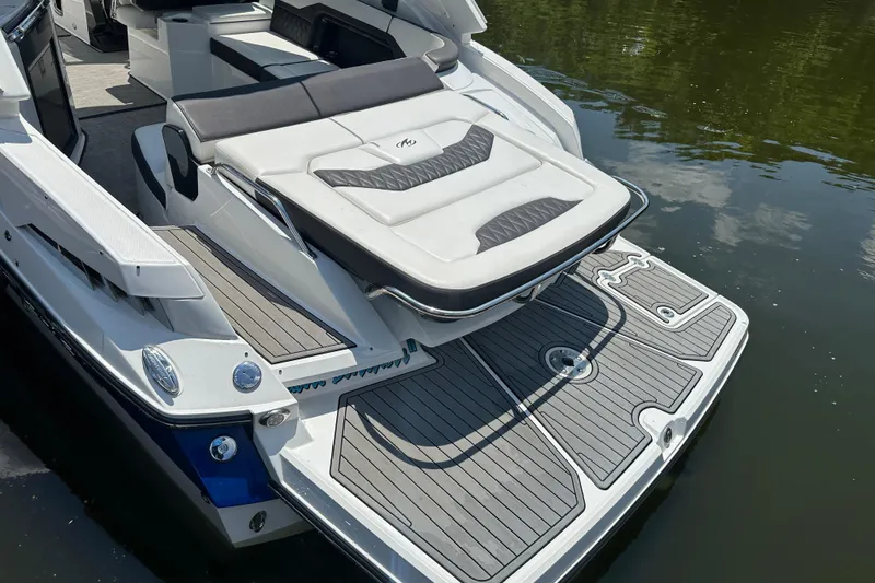 Slide: The Image of 2019 Monterey 328SS Super Sport boat with spacious swim platform and luxurious seating. - 20