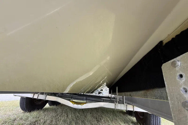 Slide: The Image of Underneath view of a 2016 Extreme Boats XC38 on a trailer. - 58