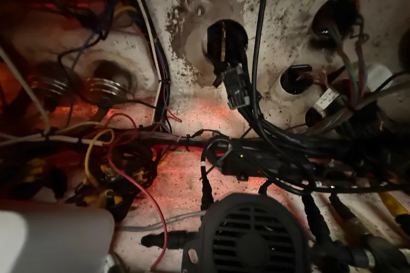 Slide: The Image of Electrical wiring and components inside a 2016 Extreme Boats XC38. - 122