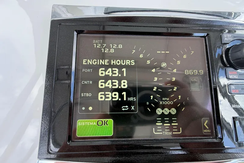 Slide: The Image of Display panel of a 2016 Extreme Boats XC38 showing engine hours and battery status. - 110