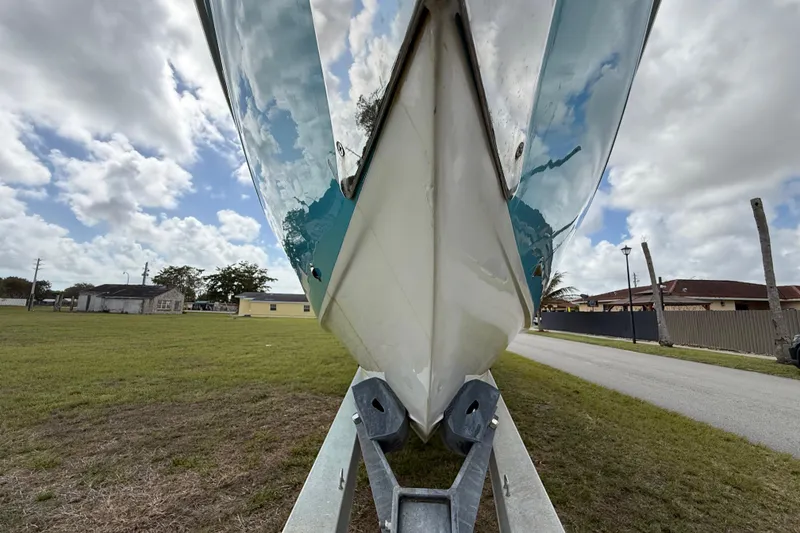 Slide: The Image of 2016 Extreme Boats XC38 on trailer, under cloudy sky, side view. - 42