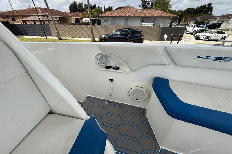 Slide: The Image of 2016 Extreme Boats XC38 interior with blue seating and modern speaker system. - 111