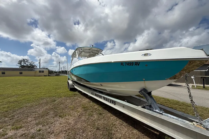 Slide: The Image of 2016 Extreme Boats XC38 on trailer under cloudy sky. - 2