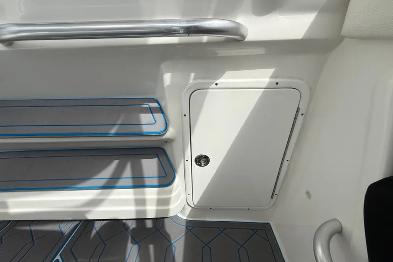 Slide: The Image of Interior view of 2016 Extreme Boats XC38, featuring storage compartment and sleek design. - 103