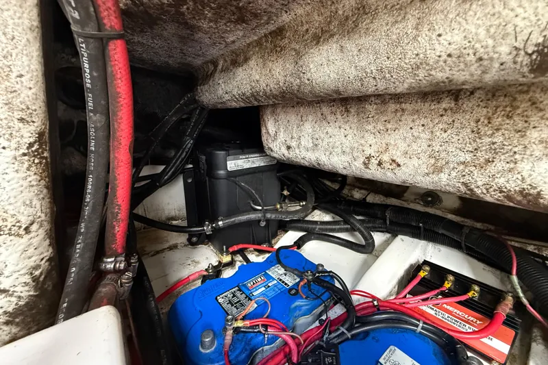 Slide: The Image of Engine compartment of 2016 Extreme Boats XC38 with battery and wiring visible. - 139