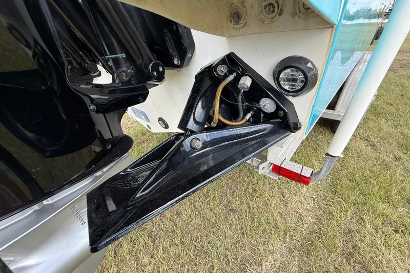 Slide: The Image of Close-up of 2016 Extreme Boats XC38 boat's stern and trim tab mechanism. - 54