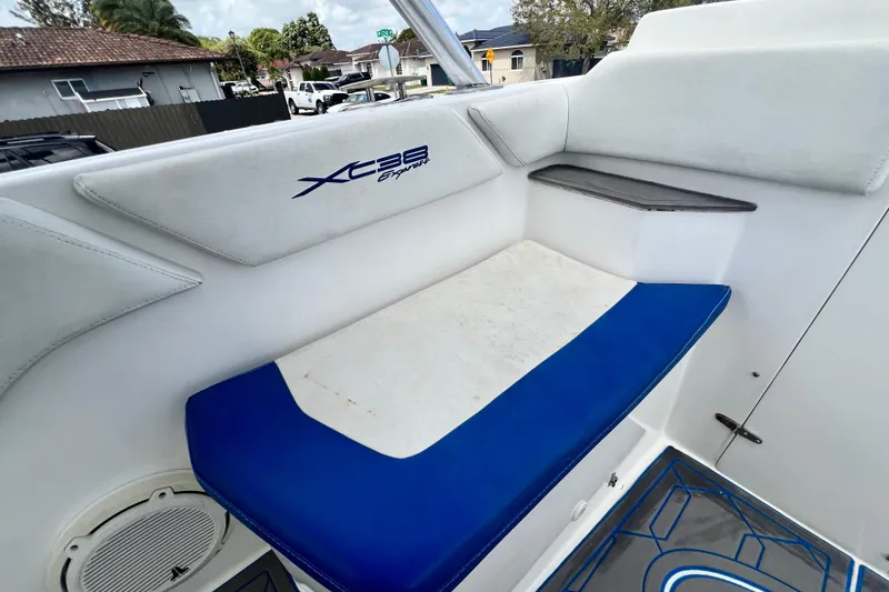 Slide: The Image of 2016 Extreme Boats XC38 interior seating with blue and white cushions. - 181