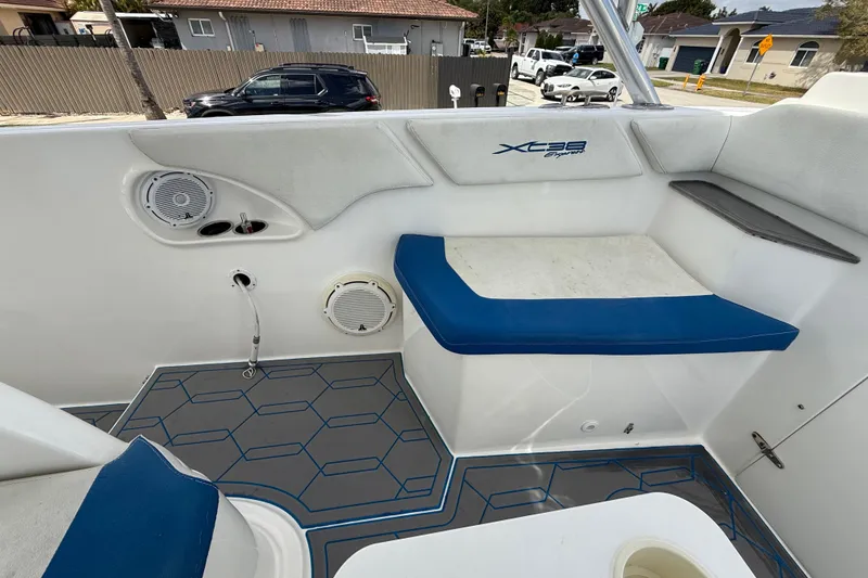 Slide: The Image of Interior of 2016 Extreme Boats XC38, featuring blue seating and modern design elements. - 112