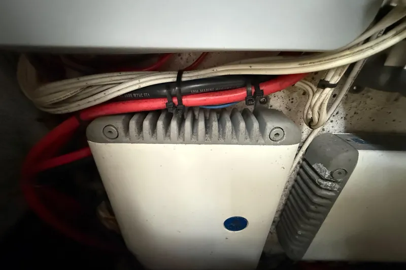 Slide: The Image of Electrical components and wiring inside a 2016 Extreme Boats XC38. - 123