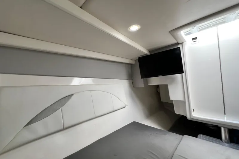 Slide: The Image of Interior cabin of 2016 Extreme Boats XC38 with modern design and mounted TV. - 159