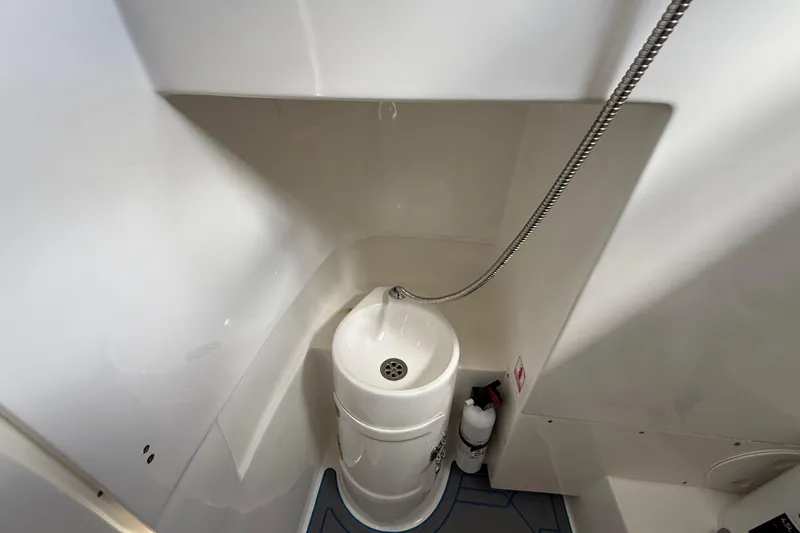 Slide: The Image of Compact bathroom in 2016 Extreme Boats XC38, featuring a sink and showerhead. - 107