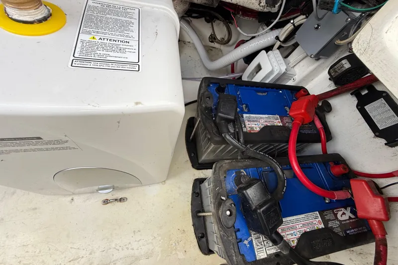 Slide: The Image of 2016 Extreme Boats XC38 battery compartment with dual batteries and wiring setup. - 138