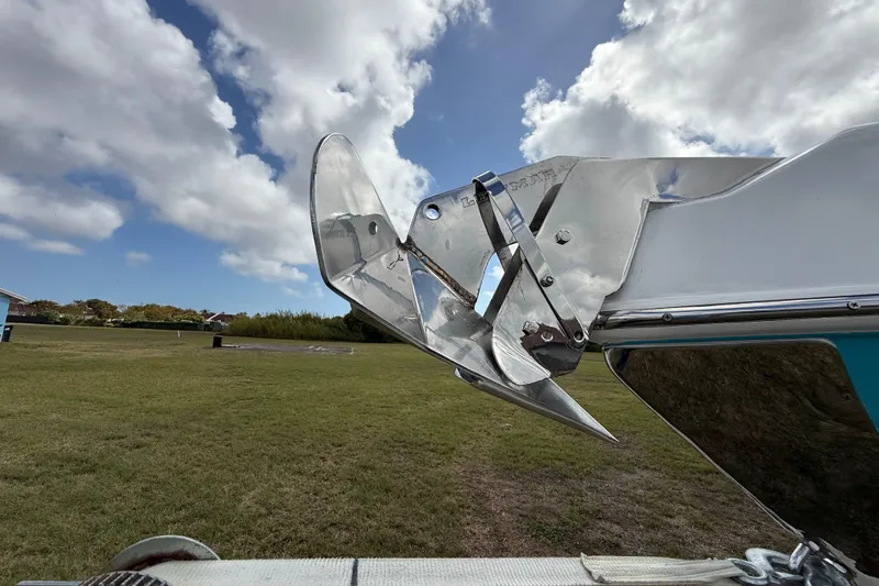 Slide: The Image of Shiny anchor on 2016 Extreme Boats XC38 against cloudy sky backdrop. - 45