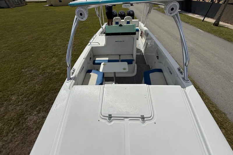 Slide: The Image of 2016 Extreme Boats XC38 interior with seating and table, parked on grass. - 151