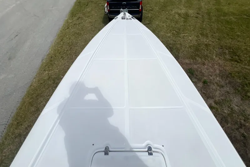 Slide: The Image of Top view of a 2016 Extreme Boats XC38 on a trailer, parked on grass. - 176