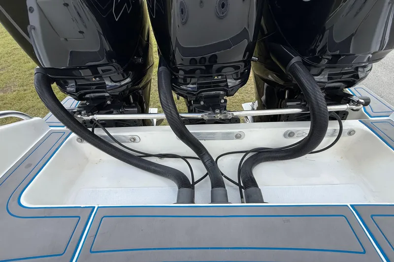 Slide: The Image of Triple outboard motors on a 2016 Extreme Boats XC38, showcasing engine connections. - 79