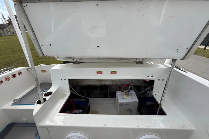 Slide: The Image of Open engine compartment of 2016 Extreme Boats XC38, showcasing battery and wiring. - 92