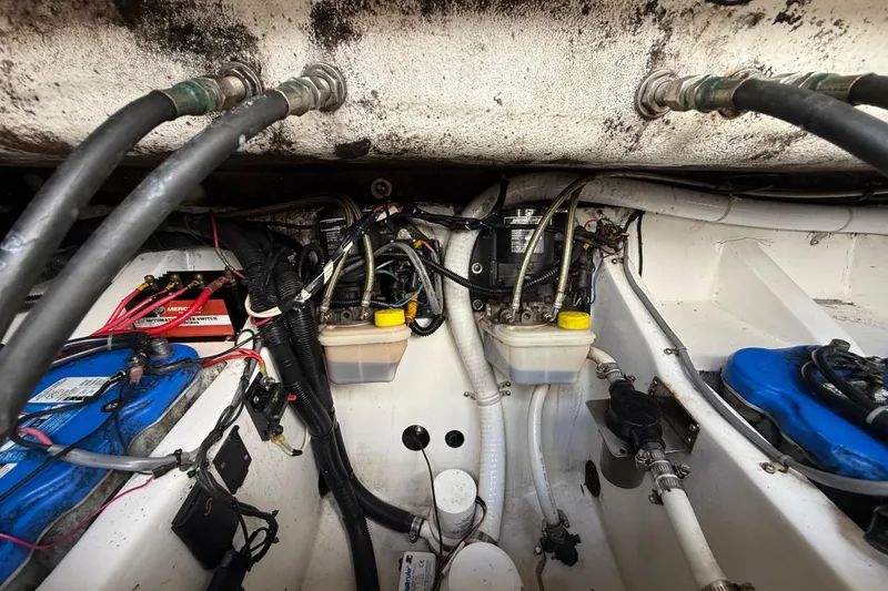Slide: The Image of Engine compartment of a 2016 Extreme Boats XC38, showing wiring and components. - 136
