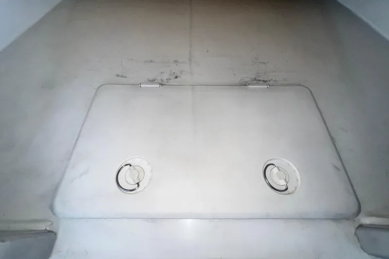 Slide: The Image of Storage compartment on a 2016 Extreme Boats XC38, featuring dual circular handles. - 154