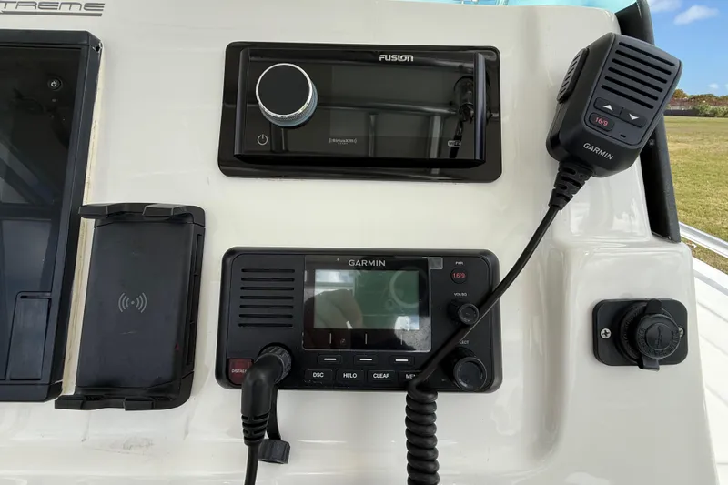 Slide: The Image of Control panel of 2016 Extreme Boats XC38 with Garmin and Fusion devices. - 86