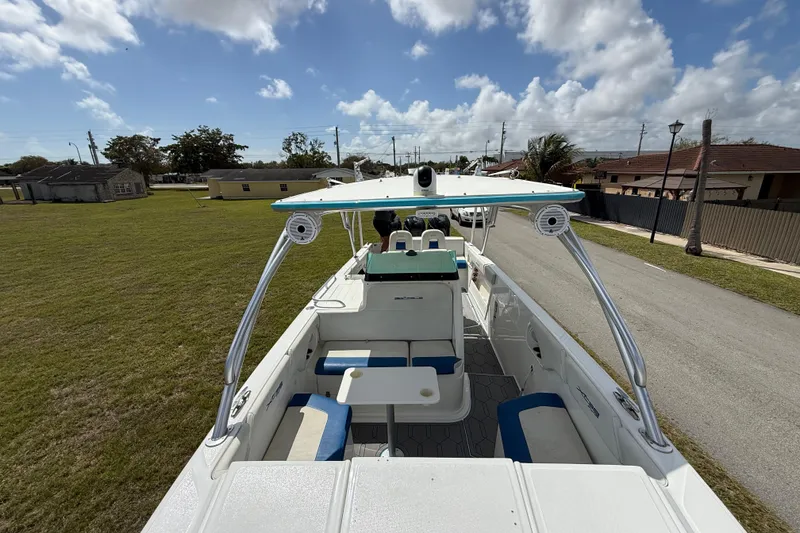 Slide: The Image of 2016 Extreme Boats XC38 on a trailer, parked in a suburban area under a cloudy sky. - 152