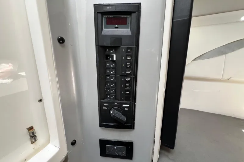 Slide: The Image of Electrical panel inside 2016 Extreme Boats XC38, featuring switches and controls. - 163