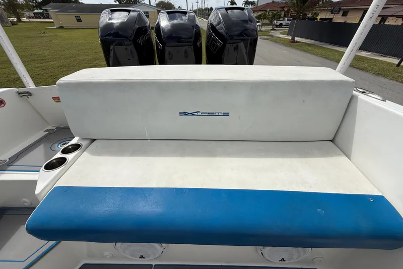 Slide: The Image of 2016 Extreme Boats XC38 with triple outboard engines and cushioned seating. - 95
