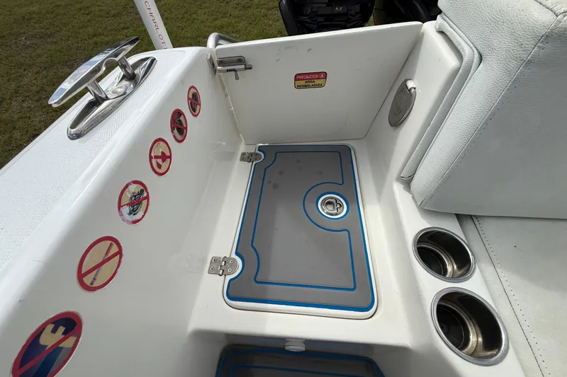 Slide: The Image of 2016 Extreme Boats XC38 interior with safety stickers and cup holders. - 97