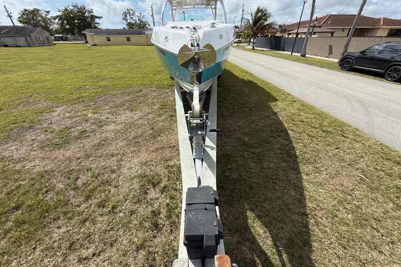 Slide: The Image of 2016 Extreme Boats XC38 on trailer, parked on grassy area near road. - 3