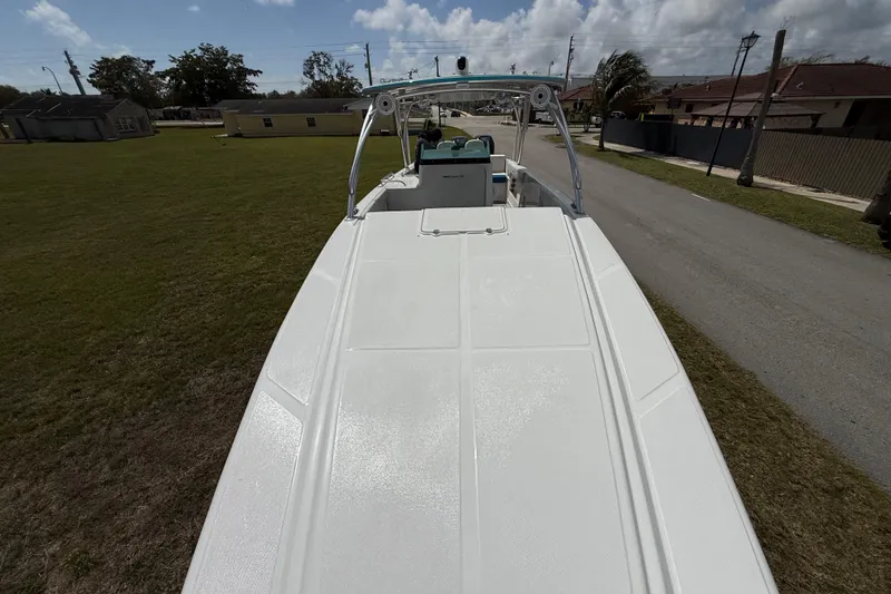 Slide: The Image of 2016 Extreme Boats XC38 on trailer, parked on grass near residential area. - 148
