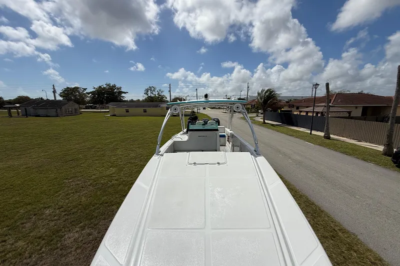Slide: The Image of 2016 Extreme Boats XC38 on trailer, parked in suburban neighborhood under cloudy sky. - 149