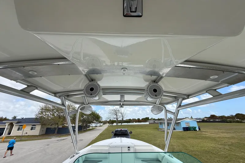 Slide: The Image of 2016 Extreme Boats XC38 with speakers on deck, parked near residential area. - 118