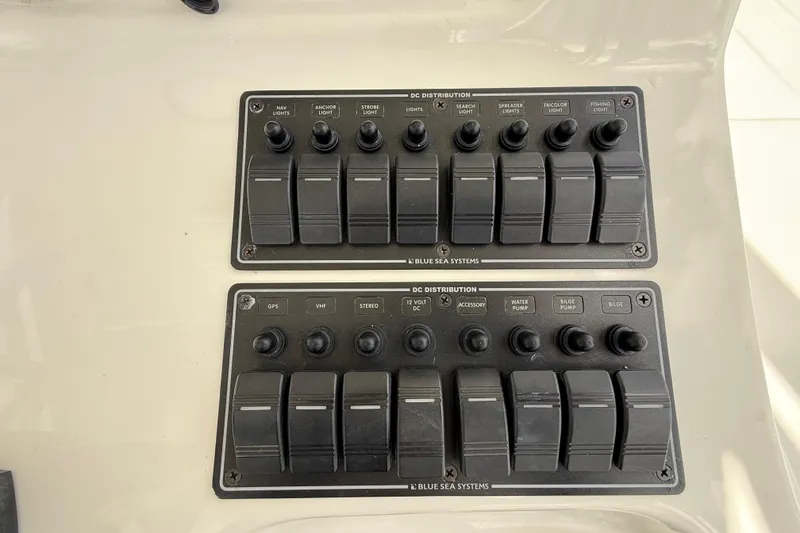 Slide: The Image of Control panel of a 2016 Extreme Boats XC38, featuring labeled switches for various functions. - 83