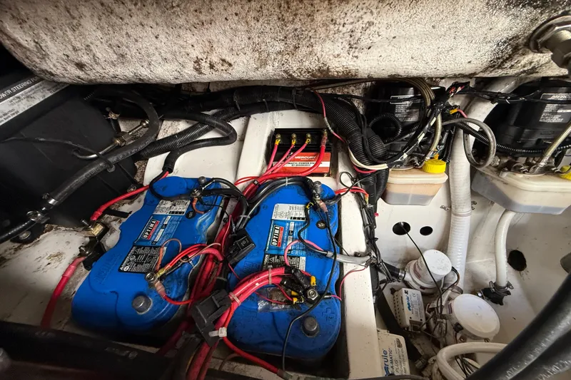 Slide: The Image of Engine compartment of a 2016 Extreme Boats XC38 with batteries and wiring. - 137