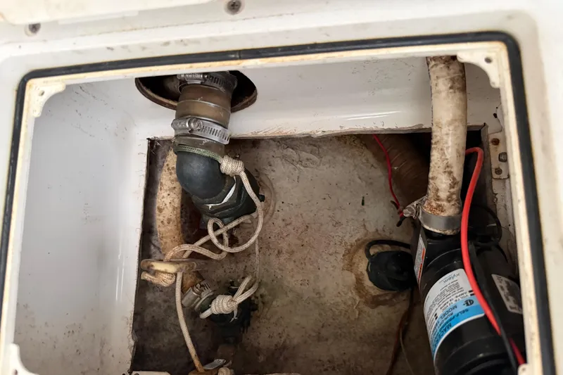 Slide: The Image of Bilge area of a 2016 Extreme Boats XC38 with hoses and pump visible. - 125