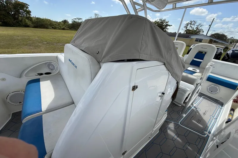 Slide: The Image of 2016 Extreme Boats XC38 interior with blue and white seating, covered console, and modern design. - 11