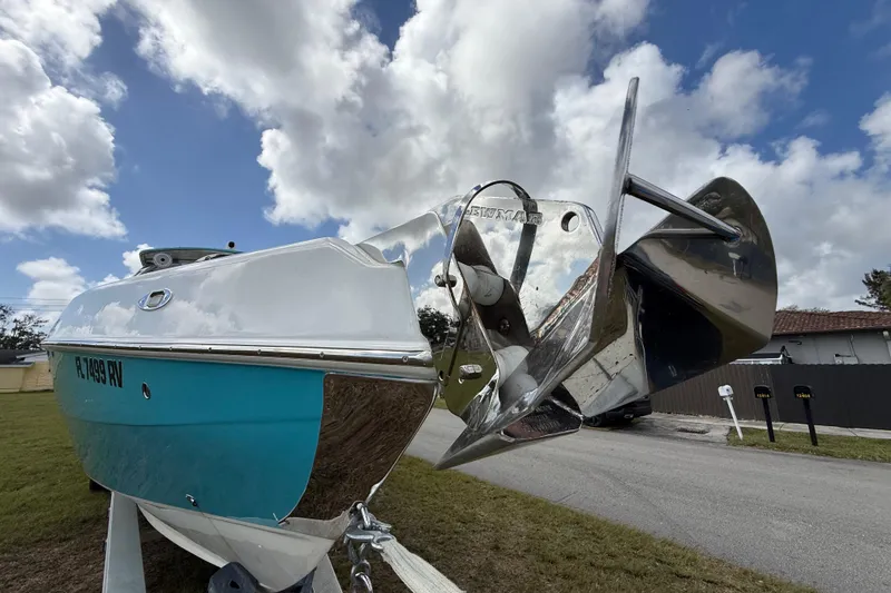 Slide: The Image of 2016 Extreme Boats XC38 with anchor, parked on grass under cloudy sky. - 43