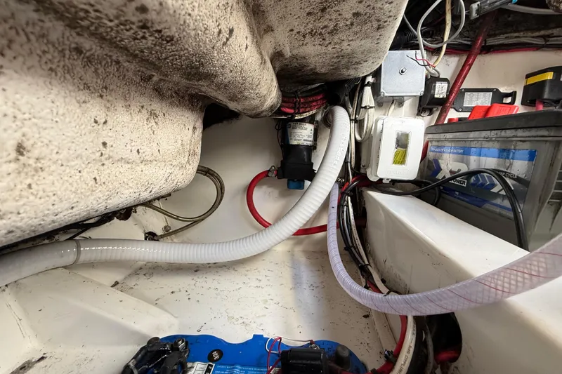 Slide: The Image of Engine compartment of a 2016 Extreme Boats XC38, showing wiring and battery setup. - 131