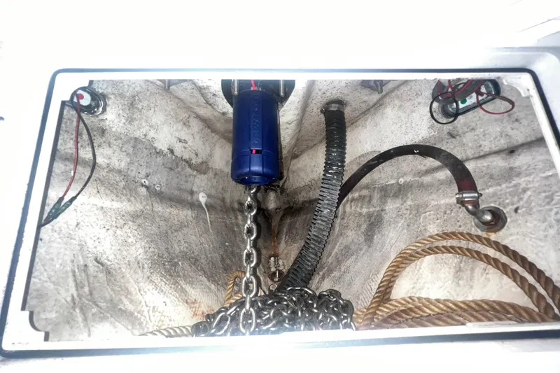 Slide: The Image of Anchor chain compartment of 2016 Extreme Boats XC38 with ropes and wiring. - 173