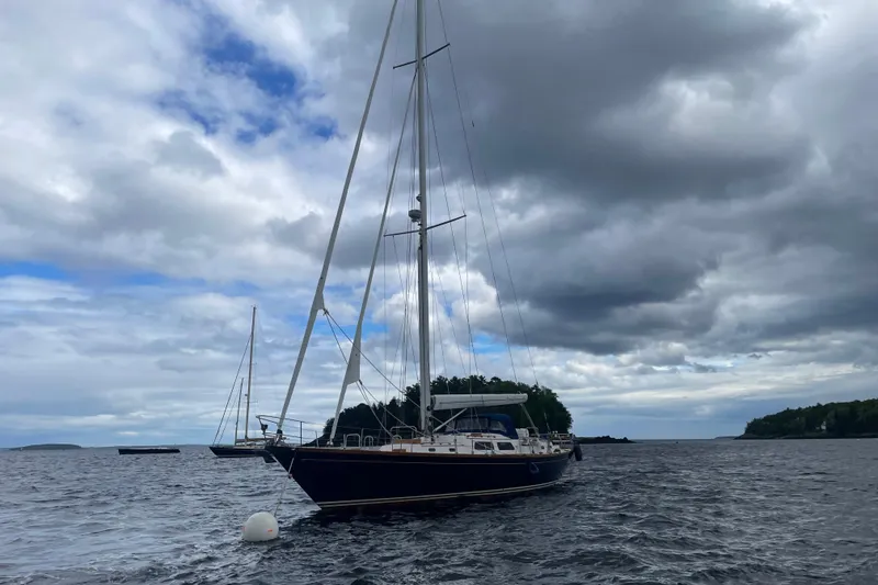 Slide: The Image of Sailing yacht Hinckley Sou'wester 59, 1985 model, anchored under cloudy skies. - 2
