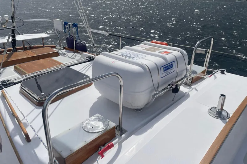 Slide: The Image of Deck of 1985 Hinckley Sou'wester 59 sailboat with safety equipment and ocean view. - 5