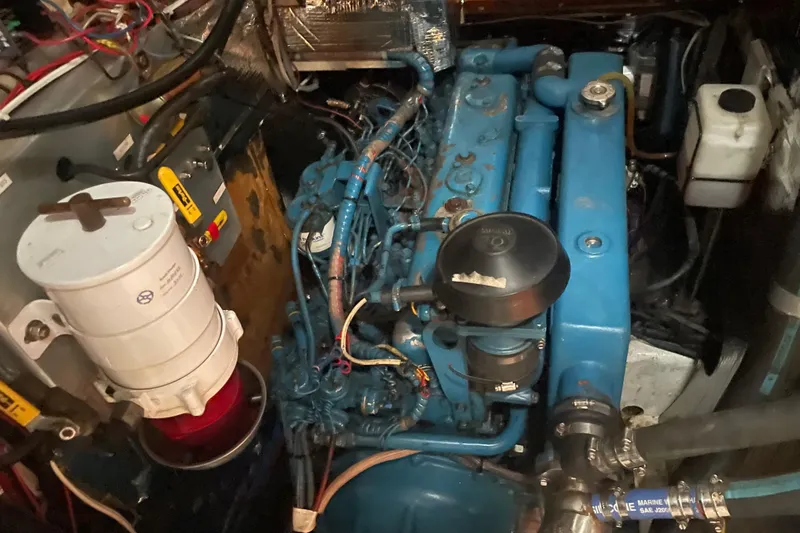 Slide: The Image of Engine compartment of a 1985 Hinckley Sou'wester 59 sailboat, showcasing mechanical components. - 16
