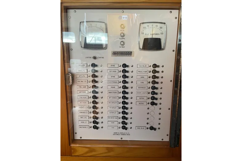 Slide: The Image of Electrical control panel on a 1985 Hinckley Sou'wester 59 yacht, featuring switches and gauges. - 20