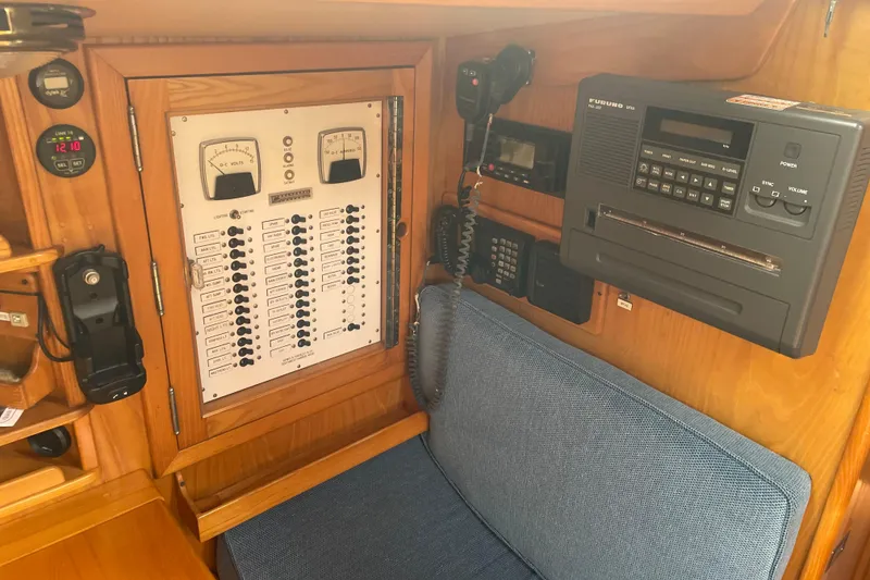 Slide: The Image of Hinckley Sou'wester 59 yacht interior, featuring control panel and communication equipment, 1985 model. - 11