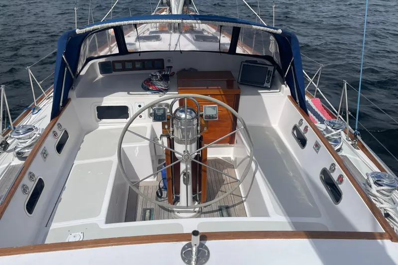 Slide: The Image of Cockpit of 1985 Hinckley Sou'wester 59 sailboat with steering wheel and navigation equipment. - 4