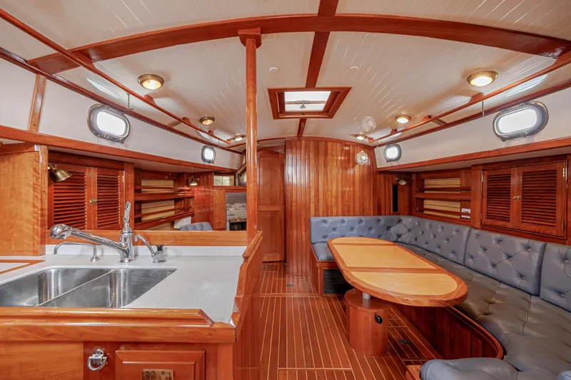 Slide: The Image of Luxurious 2001 Shannon 47/52 yacht interior with elegant wood finishes and spacious seating area. - 38