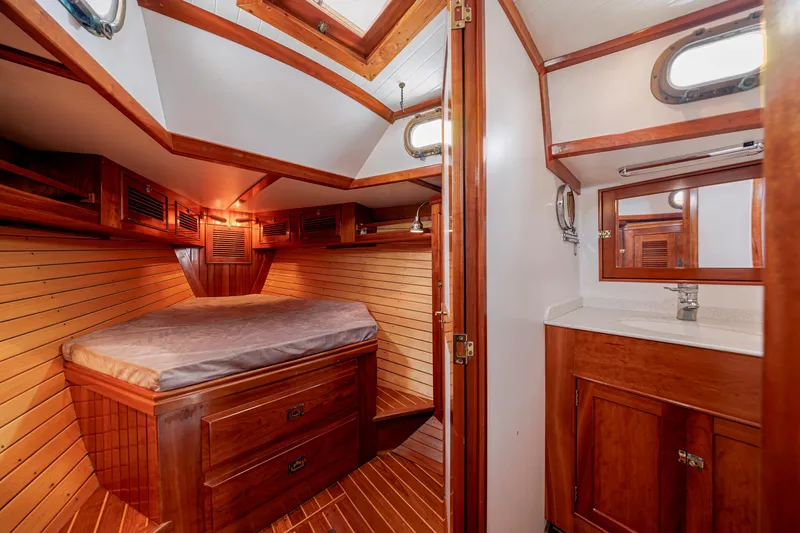 Slide: The Image of Luxurious wooden cabin interior of a 2001 Shannon 47/52 yacht with bed and bathroom. - 61