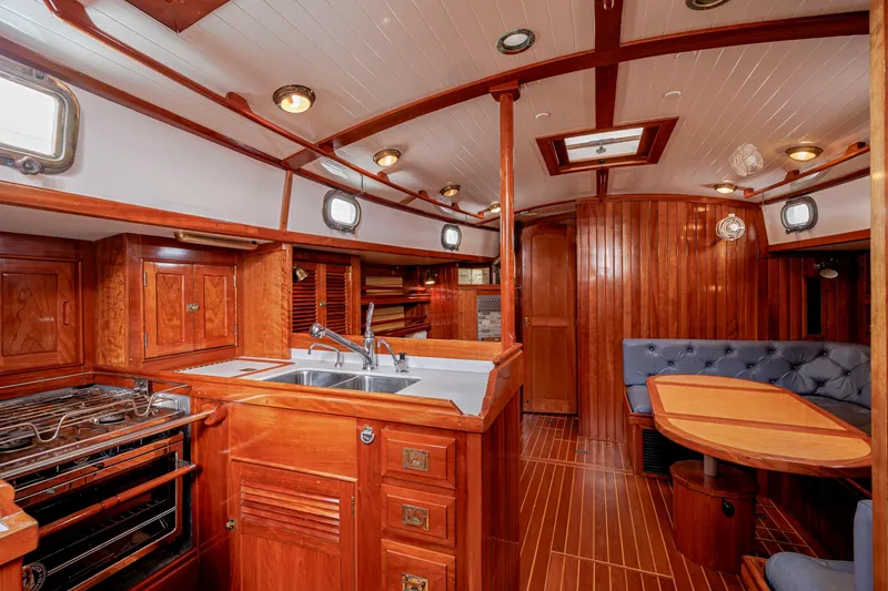 Slide: The Image of Luxurious 2001 Shannon 47/52 yacht interior with elegant wood finishes and modern amenities. - 36
