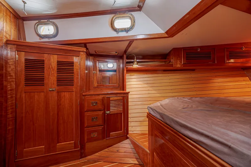 Slide: The Image of Luxurious wooden cabin interior of a 2001 Shannon 47/52 yacht with elegant furnishings. - 59