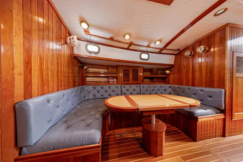 Slide: The Image of Luxurious wooden yacht interior with plush seating and elegant dining area, Shannon 47/52, 2001 model. - 55